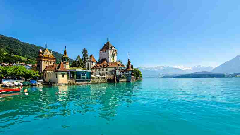Experience the enchanting Oberhofen Castle on the turquoise shores of Lake Thun in Switzerland., tags: reiseziele - pexel